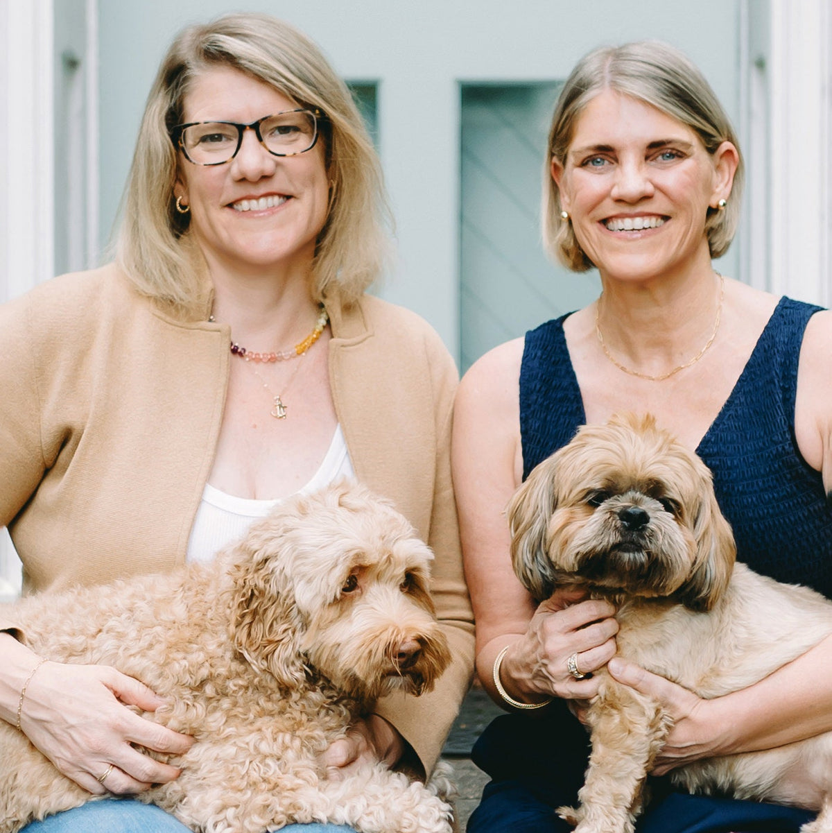 Owners of Georgie and Lottie Co with their dogs.